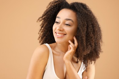 Photo of Portrait of beautiful Brazilian woman on beige background