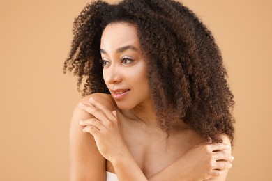 Photo of Portrait of beautiful Brazilian woman on beige background
