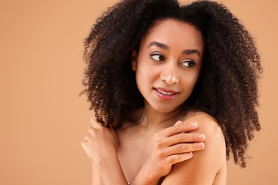 Photo of Portrait of beautiful Brazilian woman on beige background