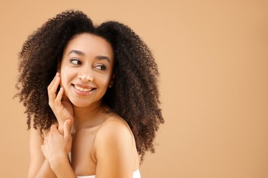 Photo of Portrait of beautiful Brazilian woman on beige background, space for text