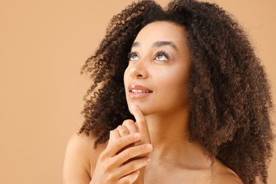 Photo of Portrait of beautiful Brazilian woman on beige background