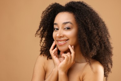Photo of Portrait of beautiful Brazilian woman on beige background