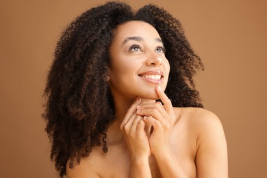 Photo of Portrait of beautiful Brazilian woman on light brown background