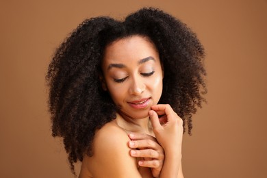 Photo of Portrait of beautiful Brazilian woman on light brown background