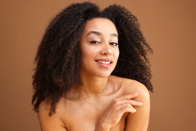 Photo of Portrait of beautiful Brazilian woman on light brown background