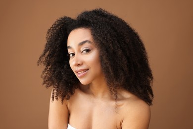 Photo of Portrait of beautiful Brazilian woman on light brown background