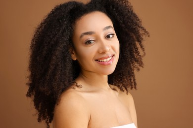 Photo of Portrait of beautiful Brazilian woman on light brown background