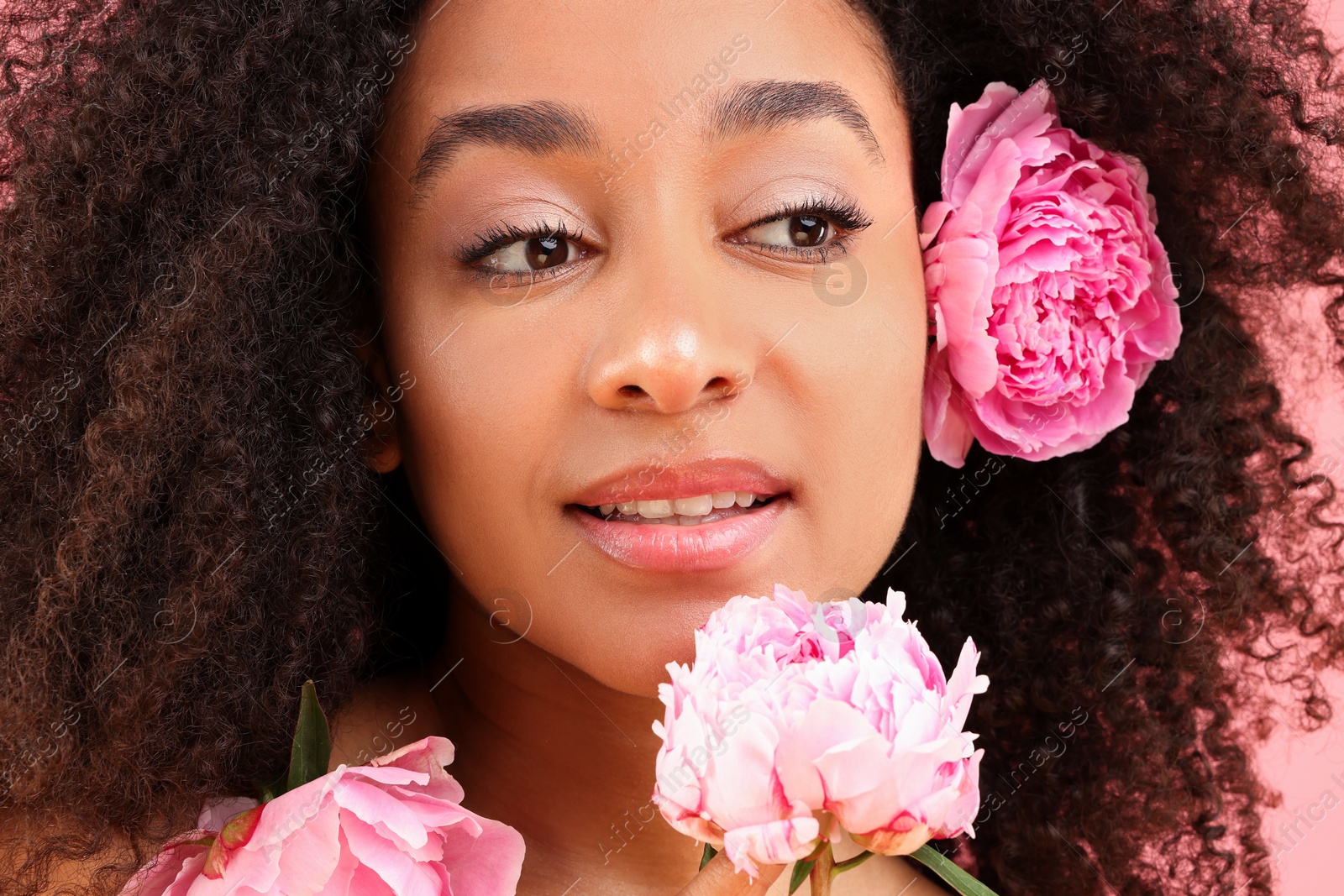 Beautiful Brazilian woman with peony flowers, closeup Photo of Beautiful Brazilian woman with peony flowers, closeup