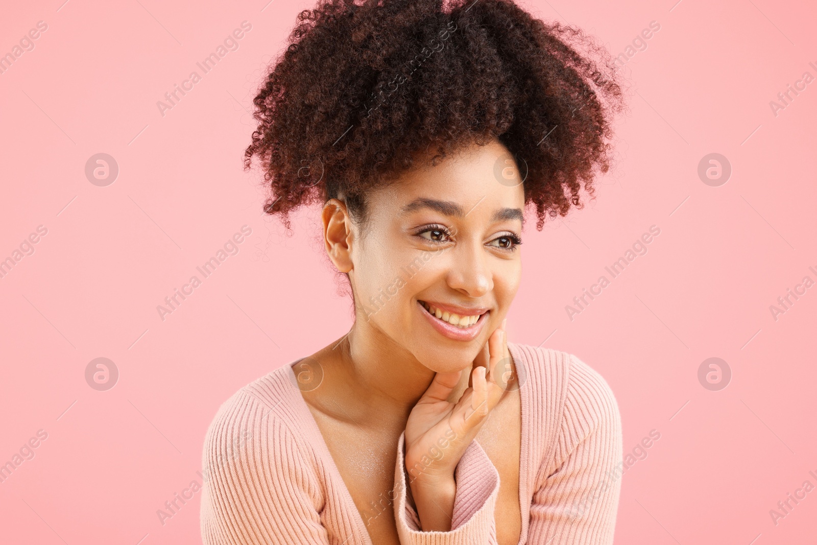 Portrait of beautiful Brazilian woman on pink background Photo of Portrait of beautiful Brazilian woman on pink background
