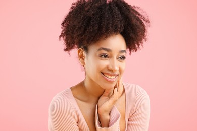 Photo of Portrait of beautiful Brazilian woman on pink background