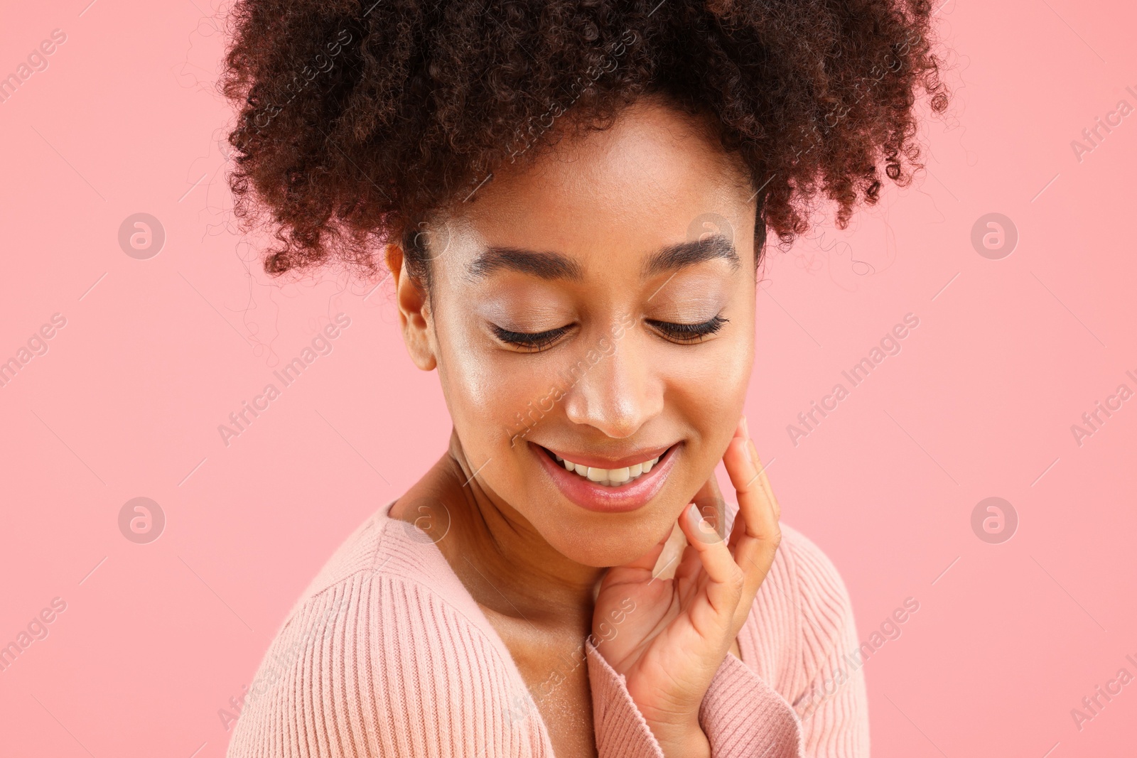 Portrait of beautiful Brazilian woman on pink background Photo of Portrait of beautiful Brazilian woman on pink background