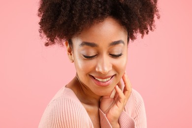 Photo of Portrait of beautiful Brazilian woman on pink background