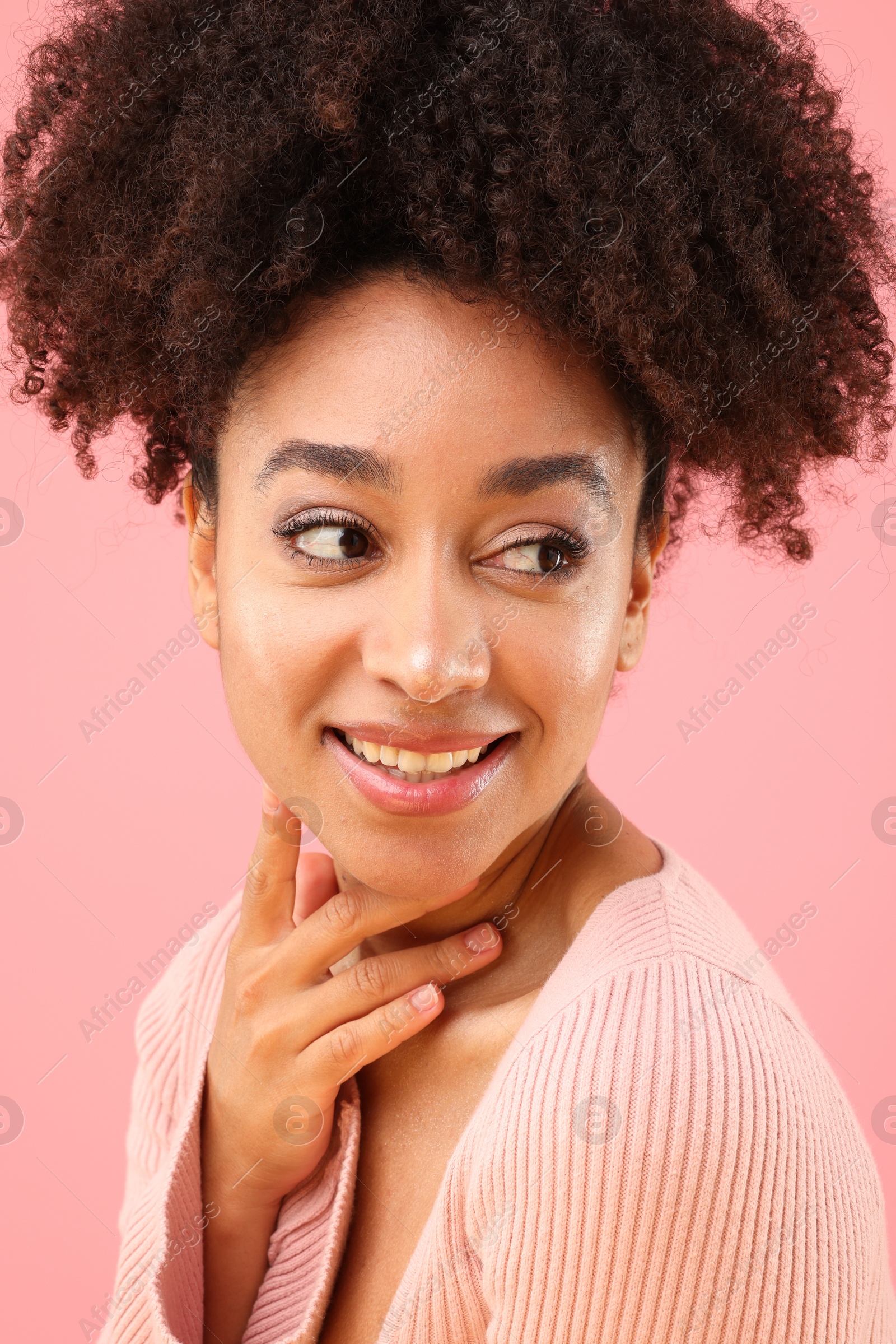 Portrait of beautiful Brazilian woman on pink background Photo of Portrait of beautiful Brazilian woman on pink background