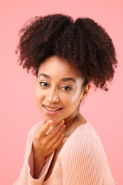 Photo of Portrait of beautiful Brazilian woman on pink background