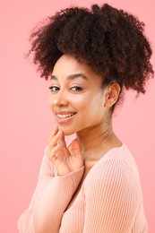 Photo of Portrait of beautiful Brazilian woman on pink background