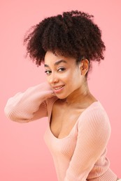 Photo of Portrait of beautiful Brazilian woman on pink background