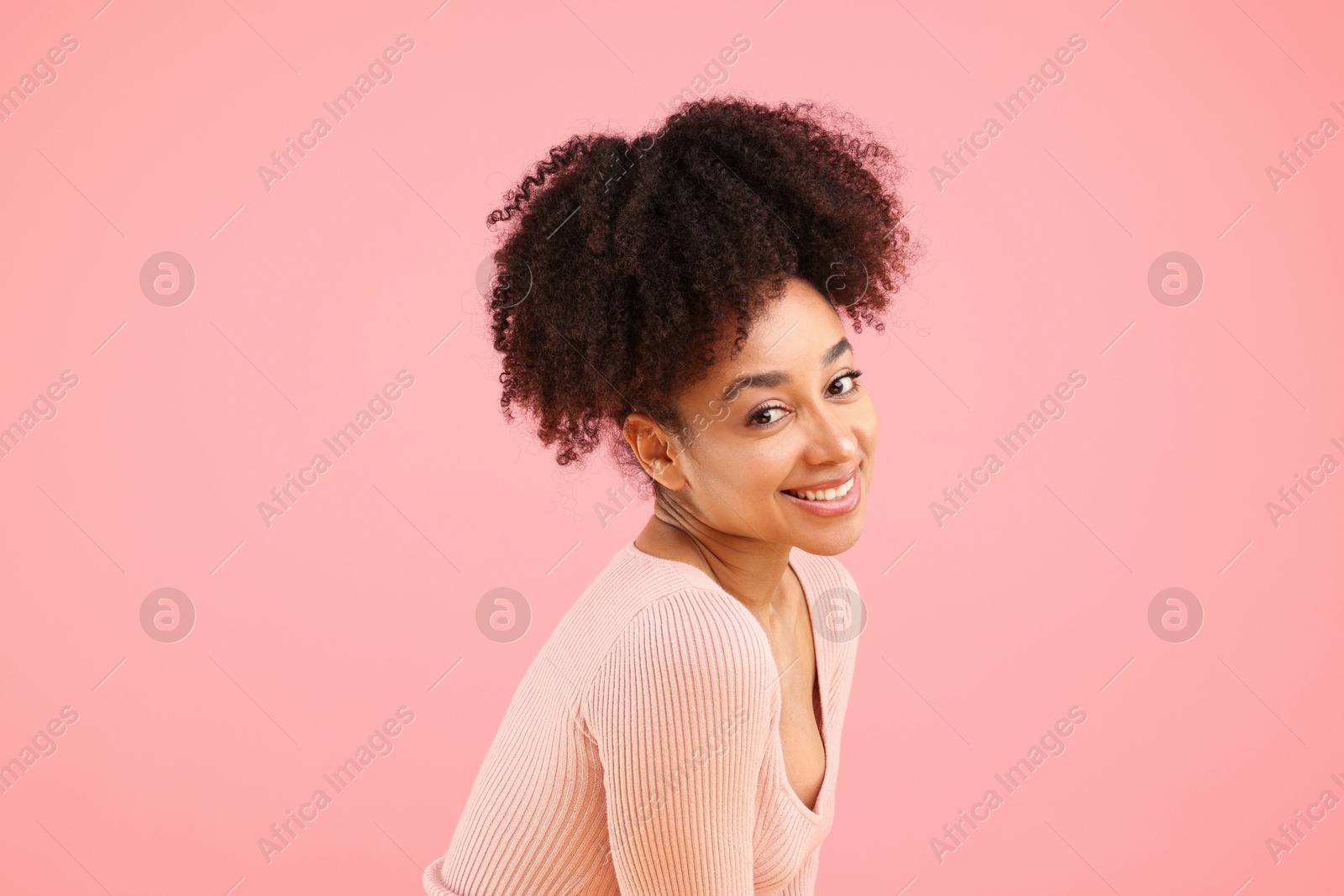 Portrait of beautiful Brazilian woman on pink background Photo of Portrait of beautiful Brazilian woman on pink background