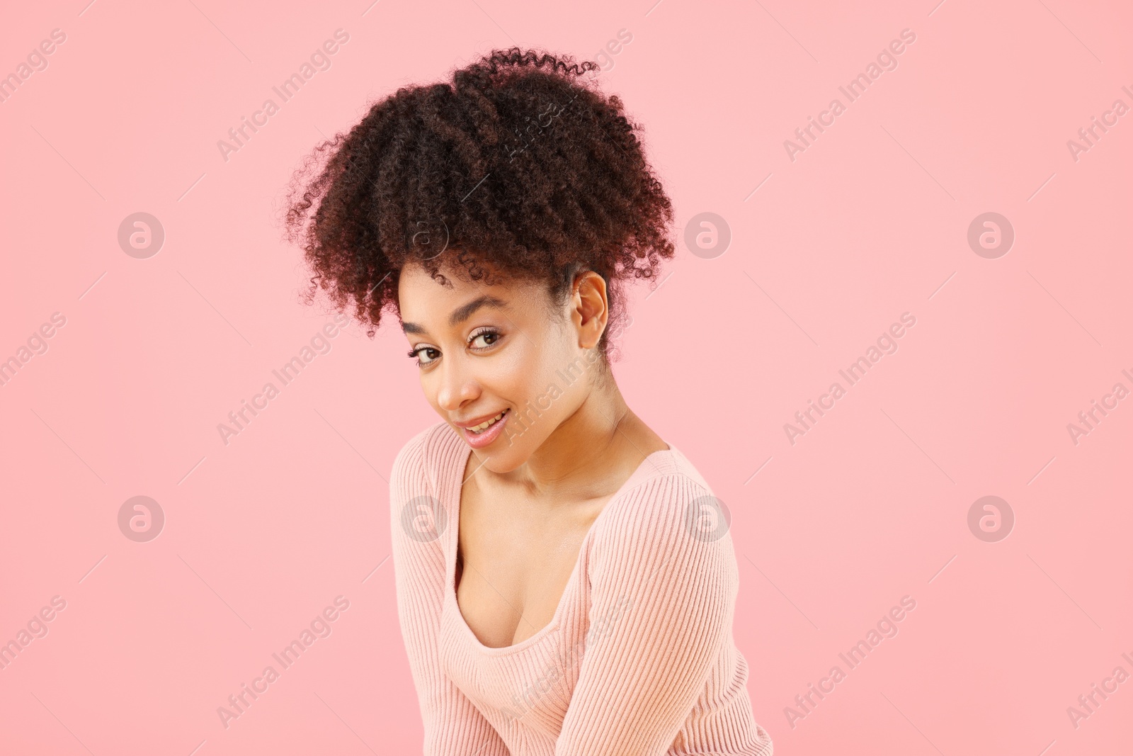 Portrait of beautiful Brazilian woman on pink background Photo of Portrait of beautiful Brazilian woman on pink background