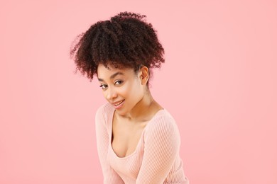 Photo of Portrait of beautiful Brazilian woman on pink background