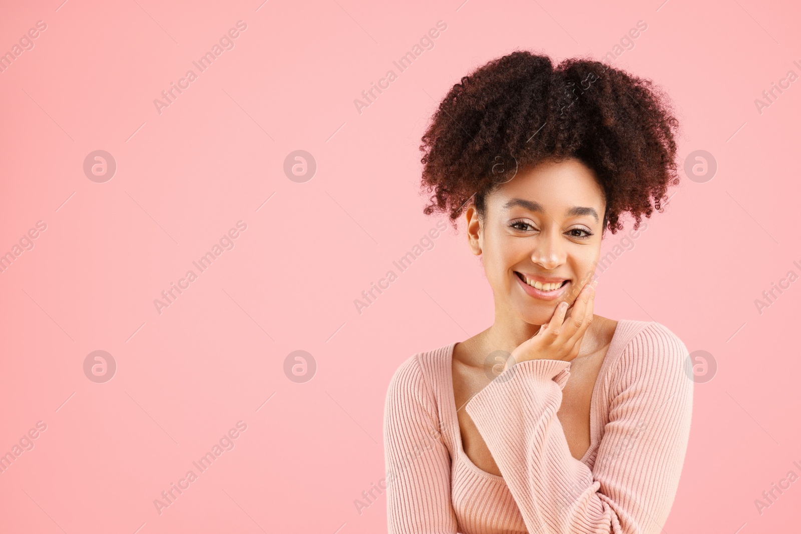 Portrait of beautiful Brazilian woman on pink background, space for text Photo of Portrait of beautiful Brazilian woman on pink background, space for text