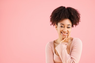 Photo of Portrait of beautiful Brazilian woman on pink background, space for text