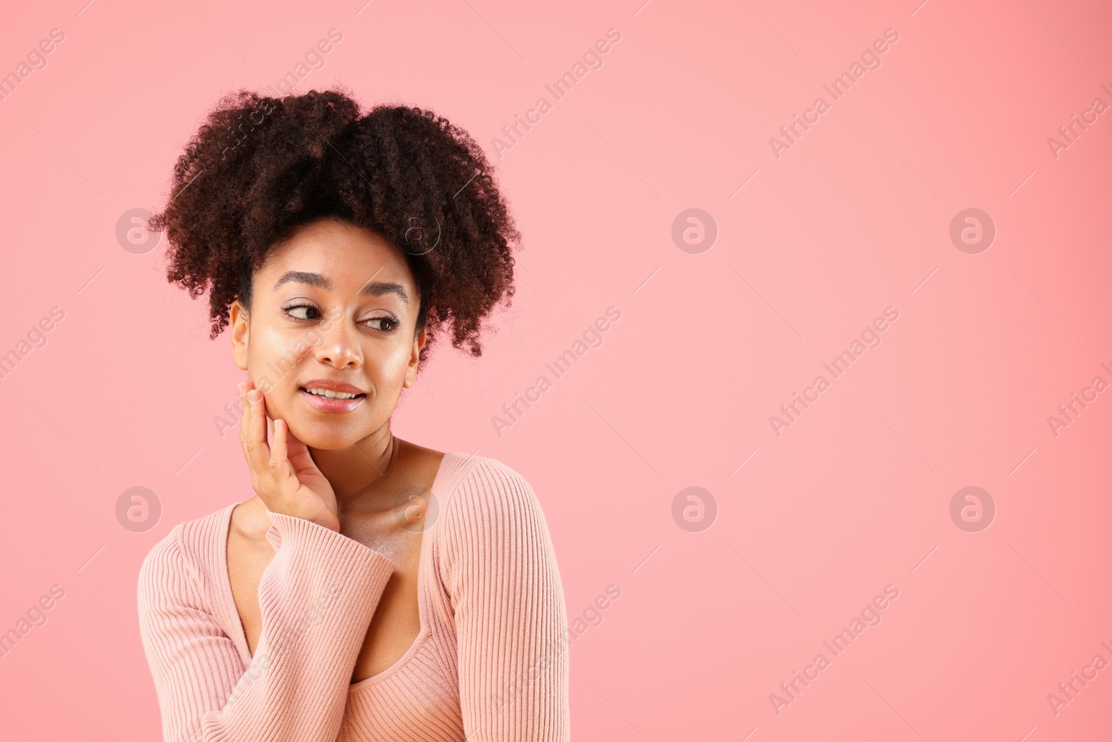Portrait of beautiful Brazilian woman on pink background, space for text Photo of Portrait of beautiful Brazilian woman on pink background, space for text