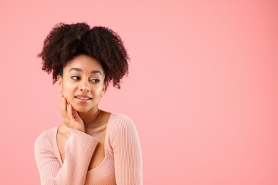 Photo of Portrait of beautiful Brazilian woman on pink background, space for text