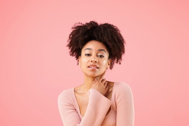 Photo of Portrait of beautiful Brazilian woman on pink background