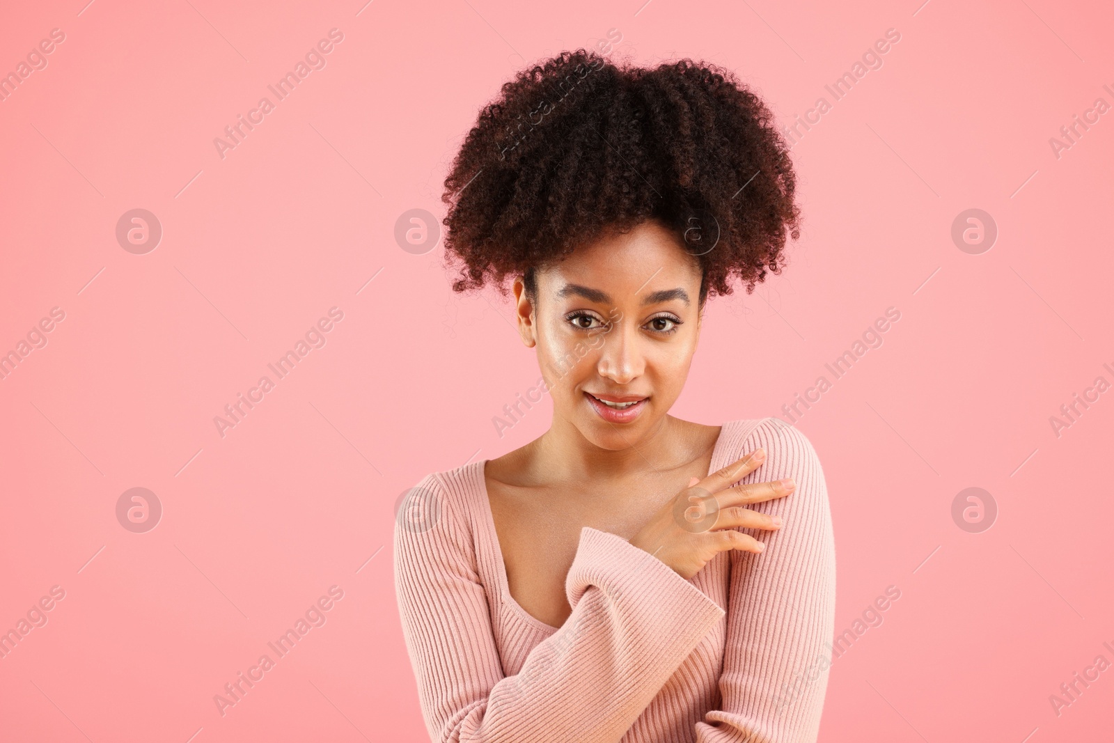 Portrait of beautiful Brazilian woman on pink background Photo of Portrait of beautiful Brazilian woman on pink background