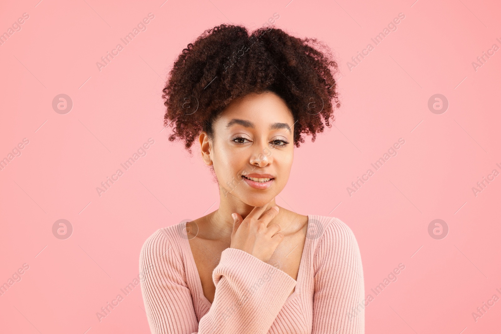 Portrait of beautiful Brazilian woman on pink background Photo of Portrait of beautiful Brazilian woman on pink background