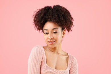 Photo of Portrait of beautiful Brazilian woman on pink background