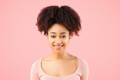 Photo of Portrait of beautiful Brazilian woman on pink background
