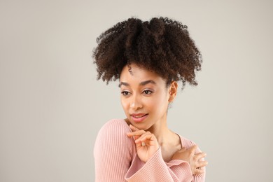 Photo of Portrait of beautiful Brazilian woman on gray background