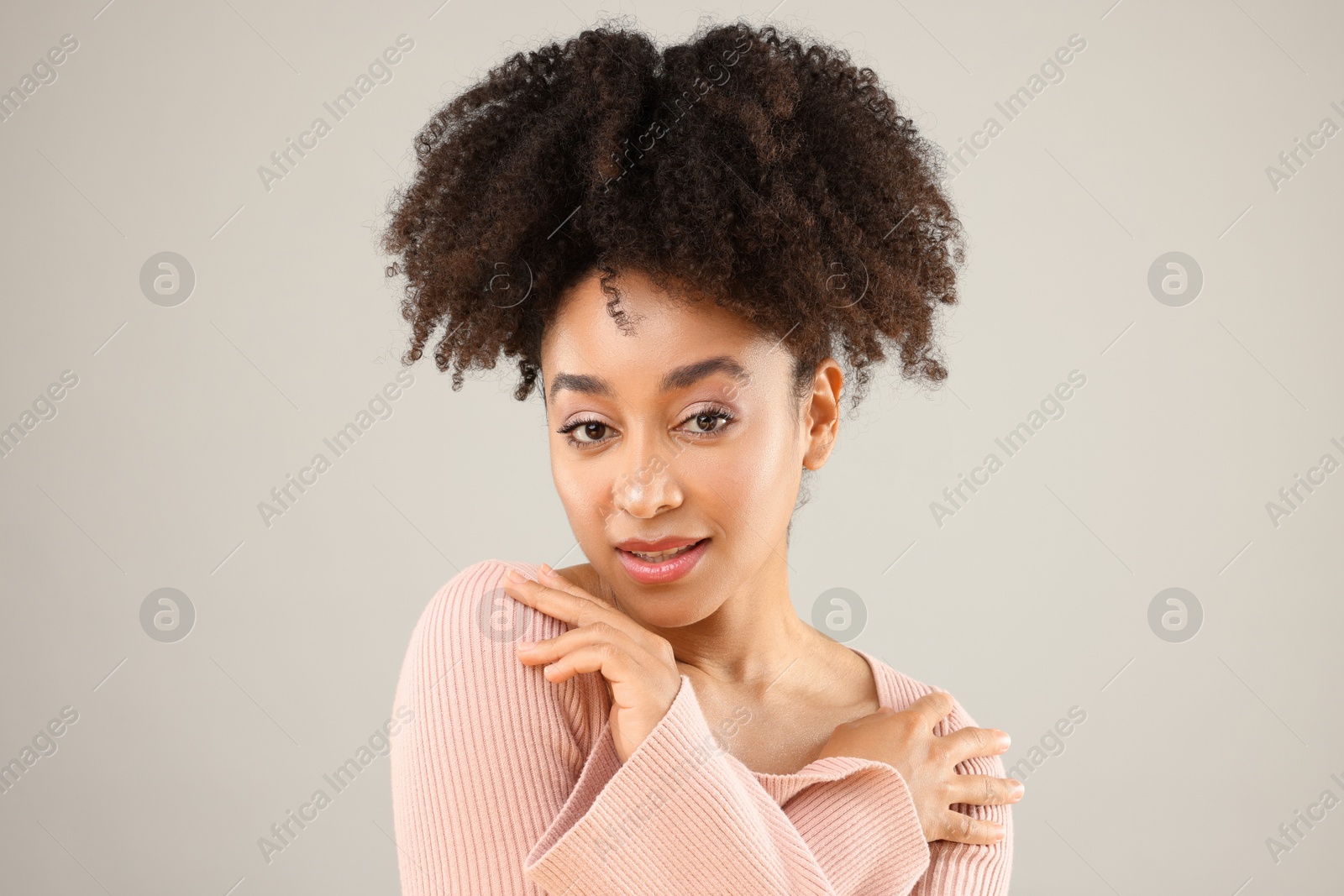 Portrait of beautiful Brazilian woman on gray background Photo of Portrait of beautiful Brazilian woman on gray background