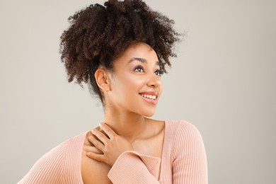 Photo of Portrait of beautiful Brazilian woman on gray background