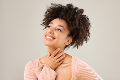Photo of Portrait of beautiful Brazilian woman on gray background