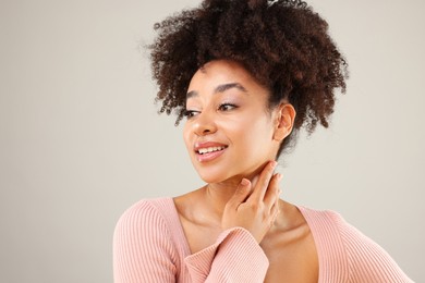 Photo of Portrait of beautiful Brazilian woman on gray background