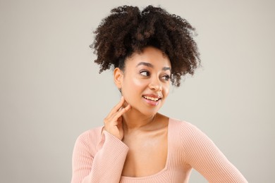 Photo of Portrait of beautiful Brazilian woman on gray background