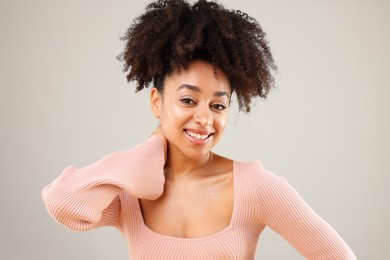 Photo of Portrait of beautiful Brazilian woman on gray background