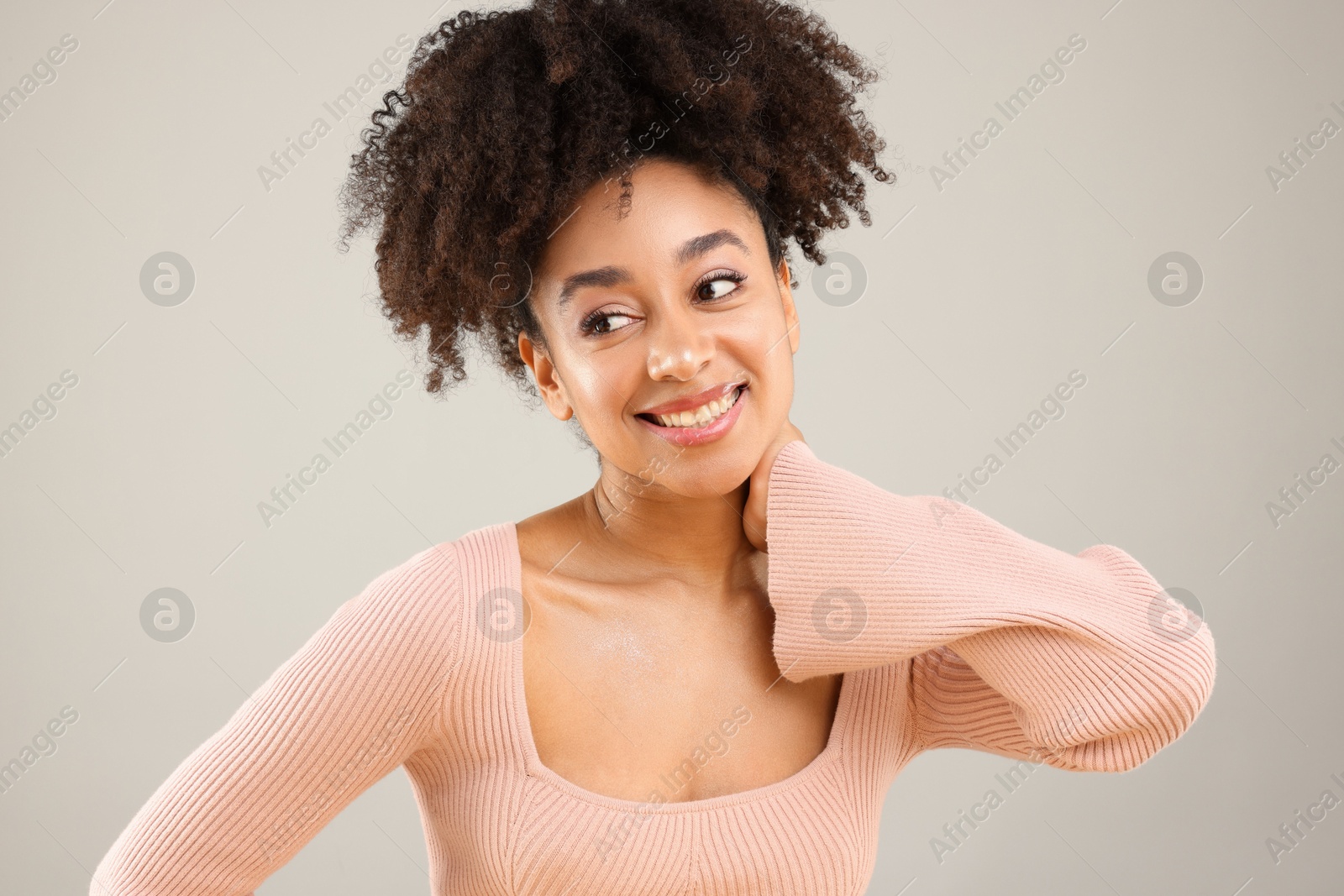 Portrait of beautiful Brazilian woman on gray background Photo of Portrait of beautiful Brazilian woman on gray background