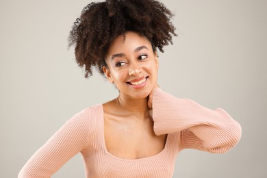 Photo of Portrait of beautiful Brazilian woman on gray background