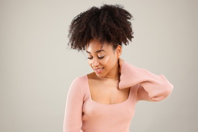Photo of Portrait of beautiful Brazilian woman on gray background