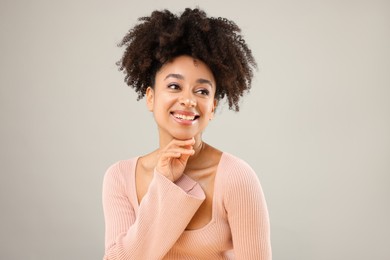 Photo of Portrait of beautiful Brazilian woman on gray background