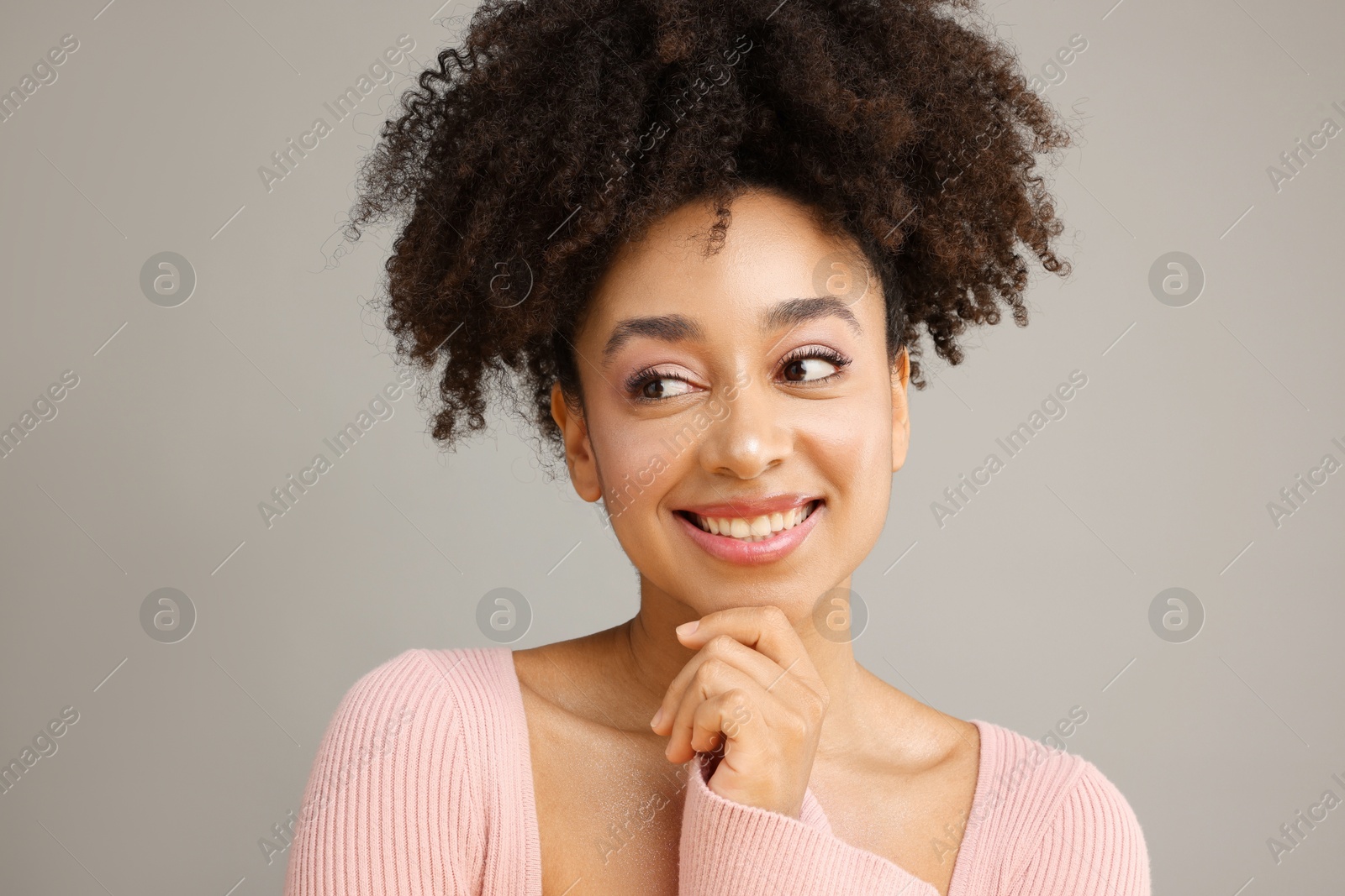 Portrait of beautiful Brazilian woman on gray background Photo of Portrait of beautiful Brazilian woman on gray background
