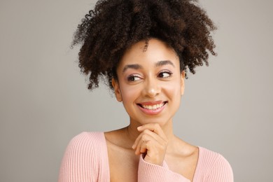 Photo of Portrait of beautiful Brazilian woman on gray background