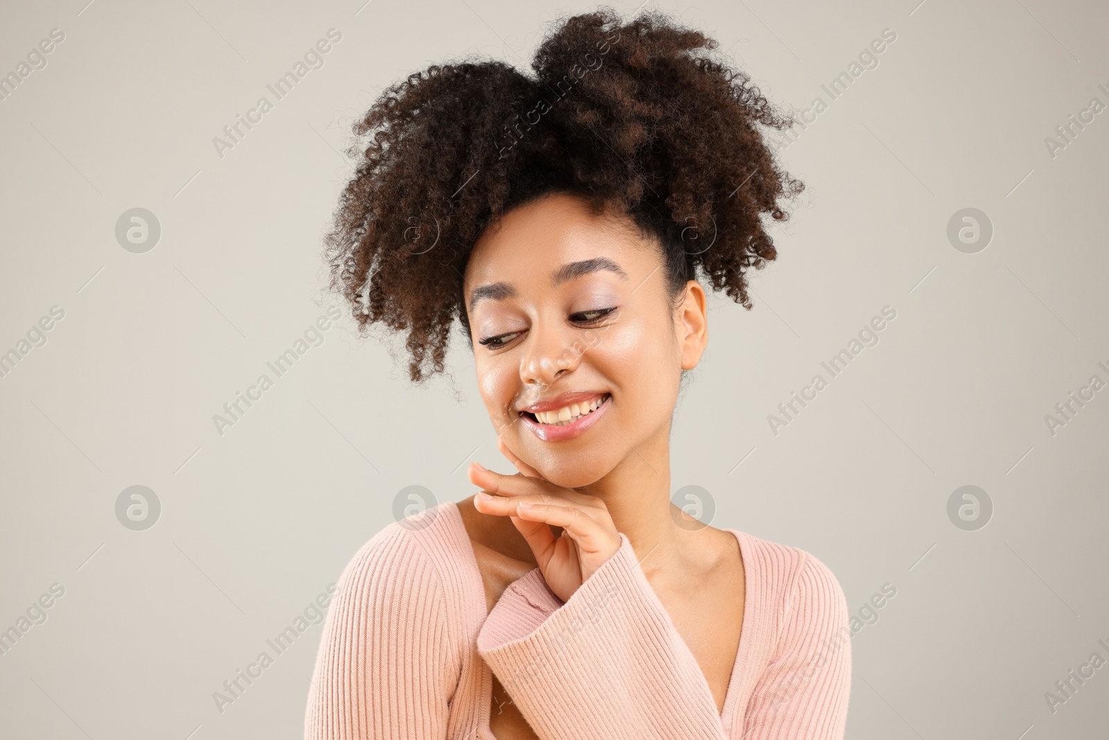 Portrait of beautiful Brazilian woman on gray background Photo of Portrait of beautiful Brazilian woman on gray background