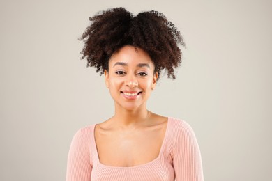 Photo of Portrait of beautiful Brazilian woman on gray background
