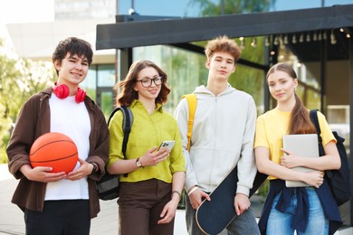 Photo of Group of teenagers spending time together outdoors