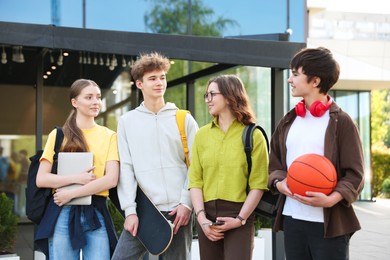 Photo of Group of teenagers spending time together outdoors