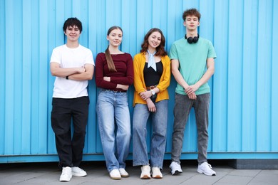 Photo of Group of happy teenagers near building outdoors